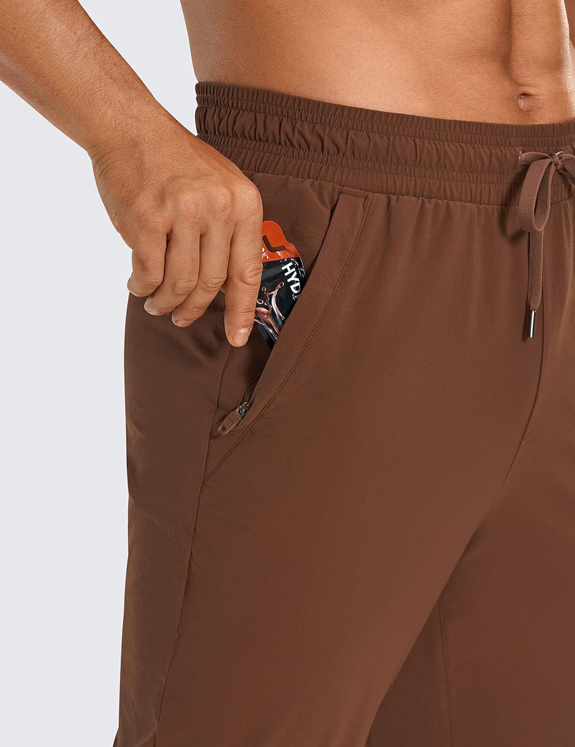 imageCRZ YOGA Stretch Workout Joggers for Men 29quot31quot Lightweight Water Resistant Outdoor Workout Pants with Zip PocketsDark Brown